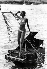 Donyale Luna (on Salvador Dali's grand piano) by Bill Claxton (1966)