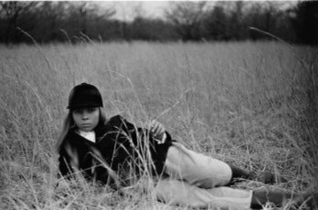 Model Penelope Tree In The Grass by Diane Arbus (1962)