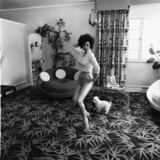 Stripper and burlesque star Blaze Starr in her living room, Baltimore by Diane Arbus (1964)