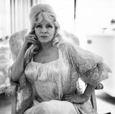 Actress Mae West in a chair at home, Santa Monica by Diane Arbus (1965)