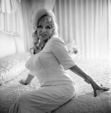 Actress Mae West on bed by Diane Arbus (1965)