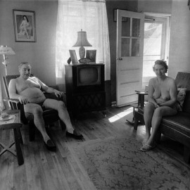 Retired man and his wife at home in a nudist camp one morning, New Jersey by Diane Arbus (1963)