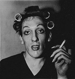 A young man in curlers at home on West 20th Street by Diane Arbus (1966)