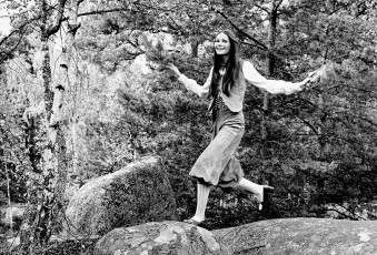Model Jumps On A Rock Wearing Buckskin Knickers by Henry Clarke (1971)