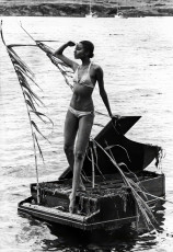 Donyale Luna (on Salvador Dali's grand piano) by Bill Claxton (1966)