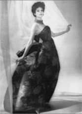 Model in beautiful ball gown of prune by Richard Dormer (1960)