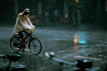 Madras, India, cyclist in the monsoon rain by Frank Horvat (1975)