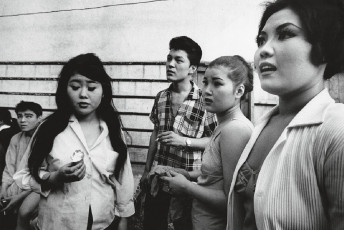 In an alley behind Asakusa strip joint, Tokyo by William Klein (1961)