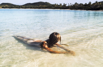 Model on L'Ansecoy Beach, Mustique by Patrick Lichfield (1972)