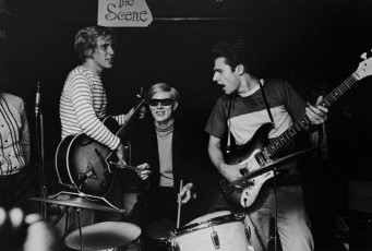 Chuck Wein, Andy Warhol, Gerard Malanga playing the band The Executives by David McCabe (1965)