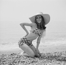 Model Justine poses on the beach by Mike McKeown (1969)