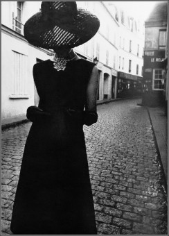 Model in dinner dress in thick black silk by David Montgomery (1964)