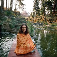 George Harrison in Shawl, Friar Park, Oxfordshire by Terry ONeill (1975)