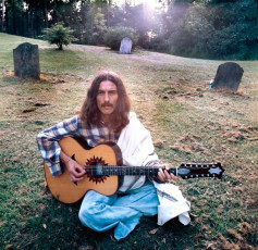 George Harrison in the grounds of his home, Friar Park by Terry ONeill (1975)