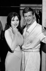 Roger Moore (english actor), Madeline Smith  (english actress) in a scene from LIVE AND LET DIE by Terry O'Neill (1973)