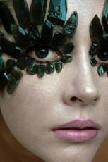 Model wearing Linde Created Emeralds eye ornaments by Gianni Penati (1968)