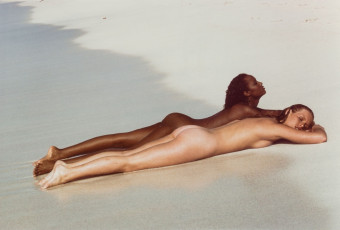 Iman, unidentified woman on beach by Francesco Scavullo (1969)