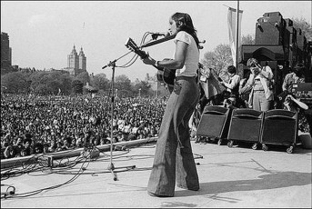 Joan Baez at the War is Over Rally in Central Park by Allan Tannenbaum / May 1975