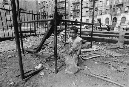 A Child Plays Alone In A Broken Down Trash Filled Lot by Allan Tannenbaum (1974)