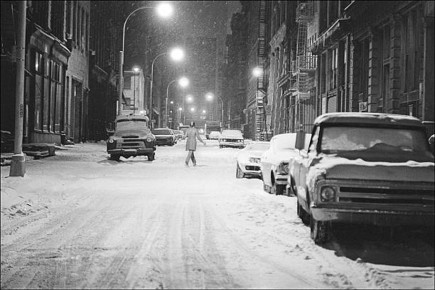 Pedestrian crossing a snow-covered street in SoHo by Allan Tannenbaum (1974)