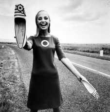 Model in a mini dress and shoes in hand (Charles Jourdan) by F.C. Gundlach (1966)