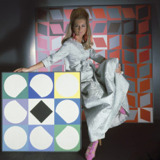 Model surrounded by artworks by Vasarely by Horst P. Horst (1966)