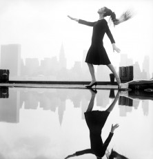 A fashion model photographed in New York wearing a Norman Norell dress by Norman Parkinson (1963)